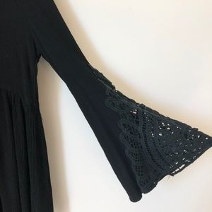 Long top with lace bell sleeves and lace up neck